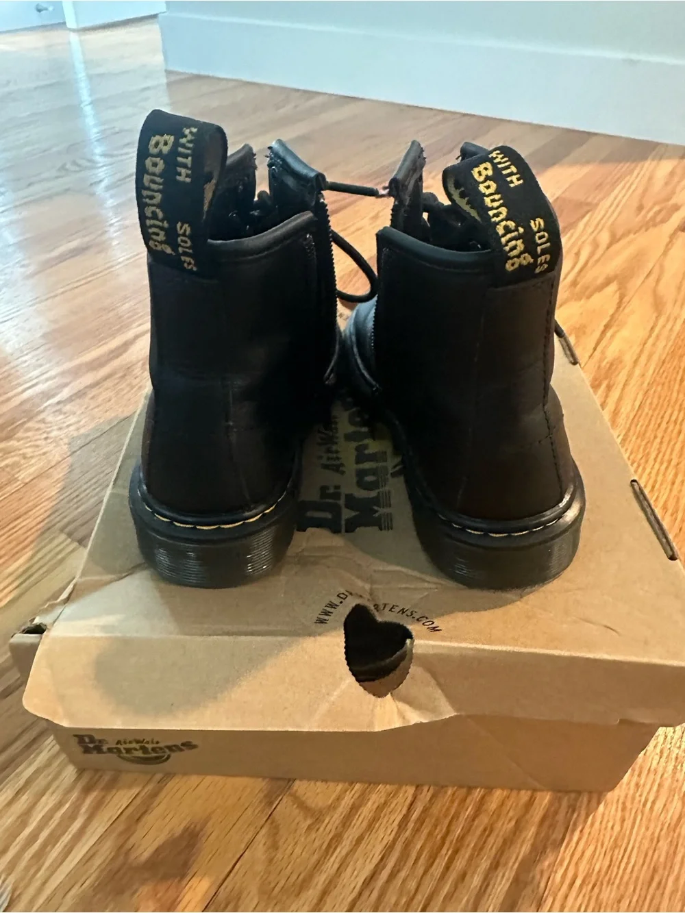 Kids Dr. Martens Black Leather 8-Eye Lace-Up Boots with Yellow Stitching